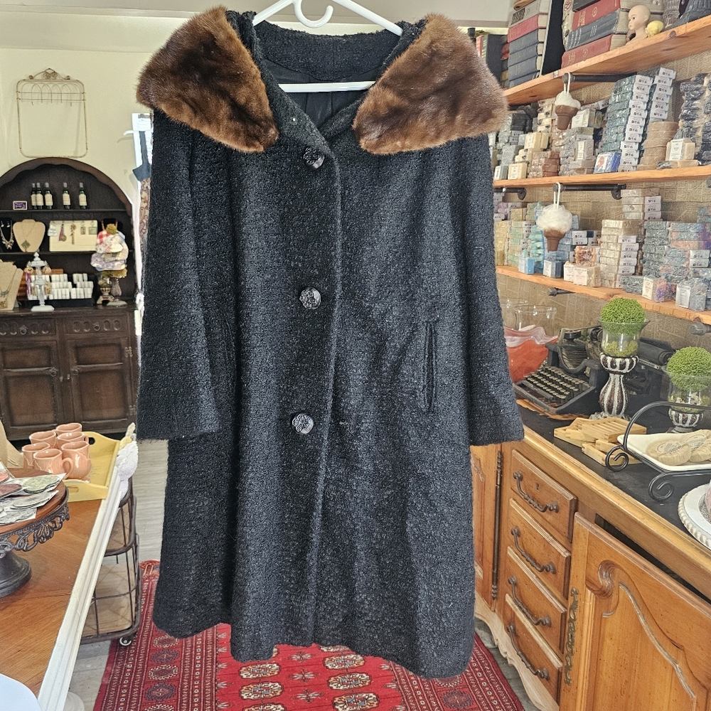 Vintage women's coat with fake fur collar.